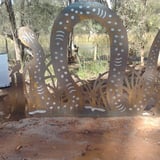 Represents the Dreaming Serpent Bimarra who guards the river and sleeps under the cliff face at Ellendale Pool.