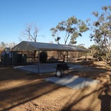 A large covered shelter with benches and a gas BBQ are available for users. 