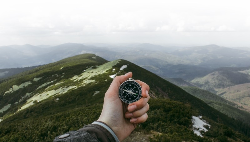 Photo of someone holding a compass