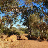 Head southwest of the car park and start the trail between four boulders.