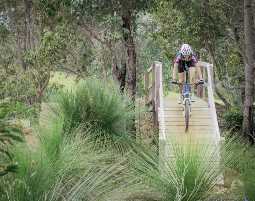 As part of the Dunsborough Country Club trails the trail loops under itself before riding over the top on a bridge. Rider Jane Deane 