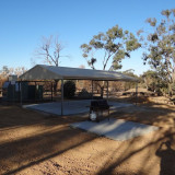 A large covered shelter with benches and a gas BBQ are available for users. 