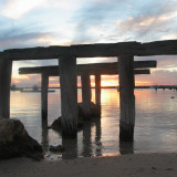 The remnants of the old jetty still stand along the Port Denison Foreshore. 