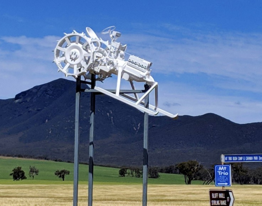 Snowy skis down the ranges as he points visitors to the Bluff Knoll Ski club.  Snowy is the last tractor on The Horsepower Highway interactive map.